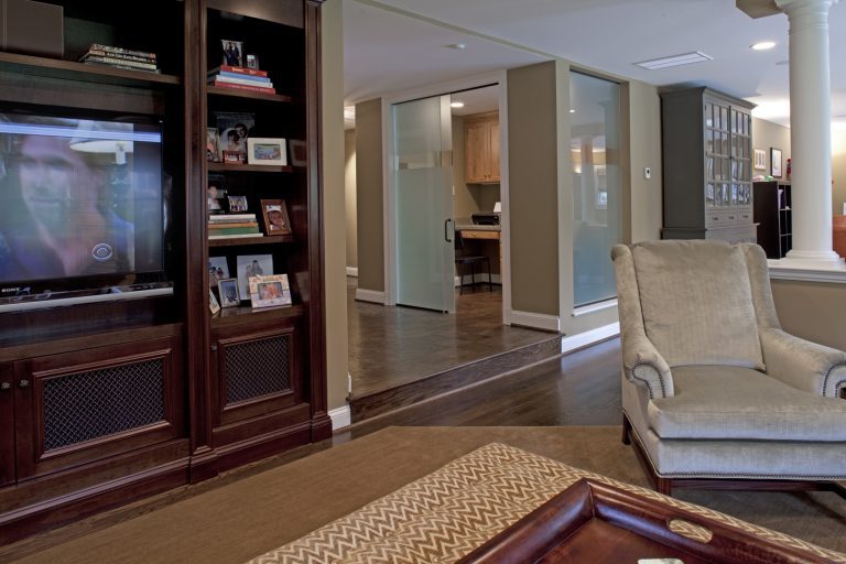 renovated sunken living area with built in entertainment center warm color tones