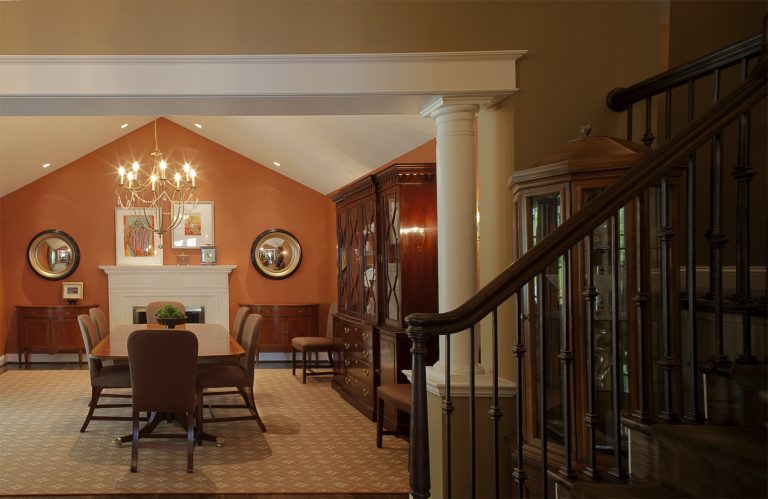 renovated entryway warm and inviting flows into dining room with vaulted ceiling