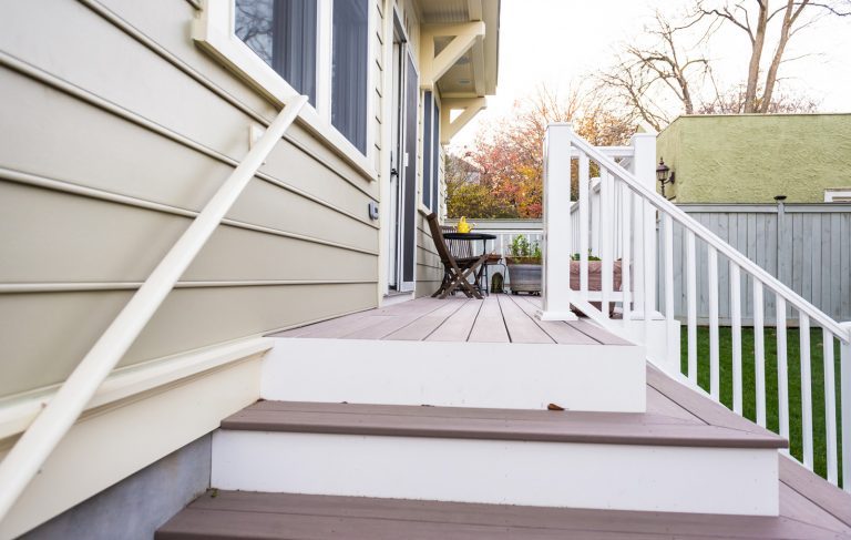 stairs leading to new back deck on craftsman style home