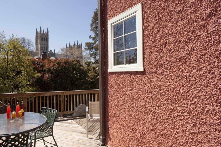 DC rowhouse addition upper deck seating area with view of National Cathedral