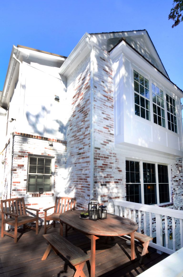 new second story deck on traditional virginia home dark wood with light wood railings