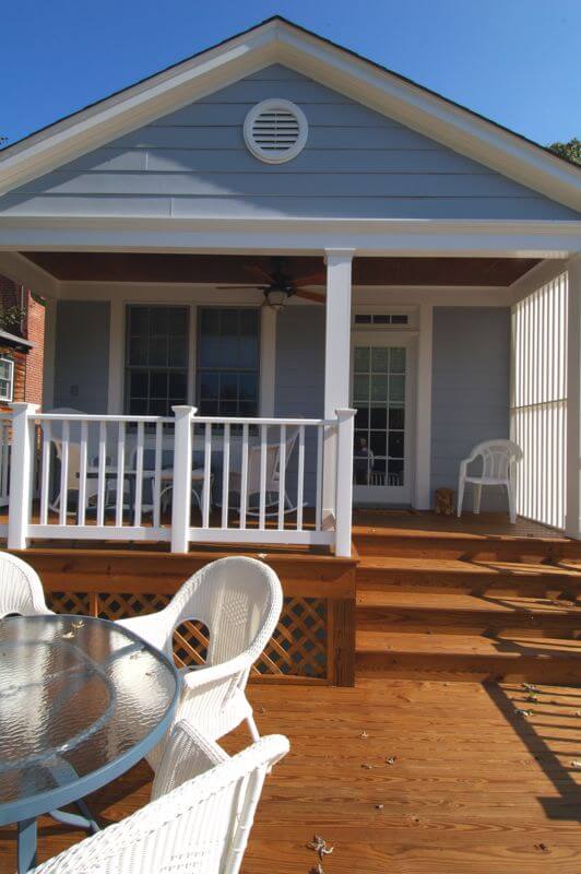 glass doors lead out to second story back porch and deck addition multi level