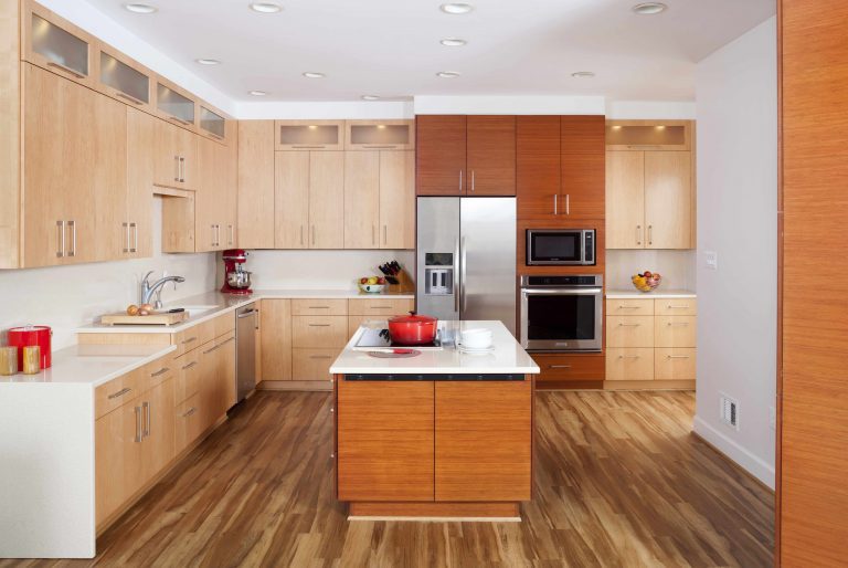 modern kitchen lots of storage various wood tones waterfall edge countertops