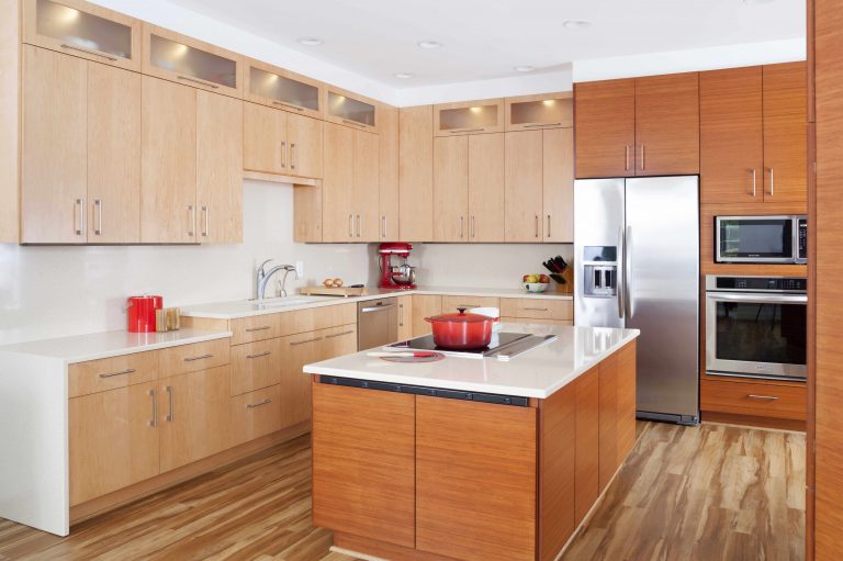 modern kitchen lots of storage various wood tones waterfall edge countertops