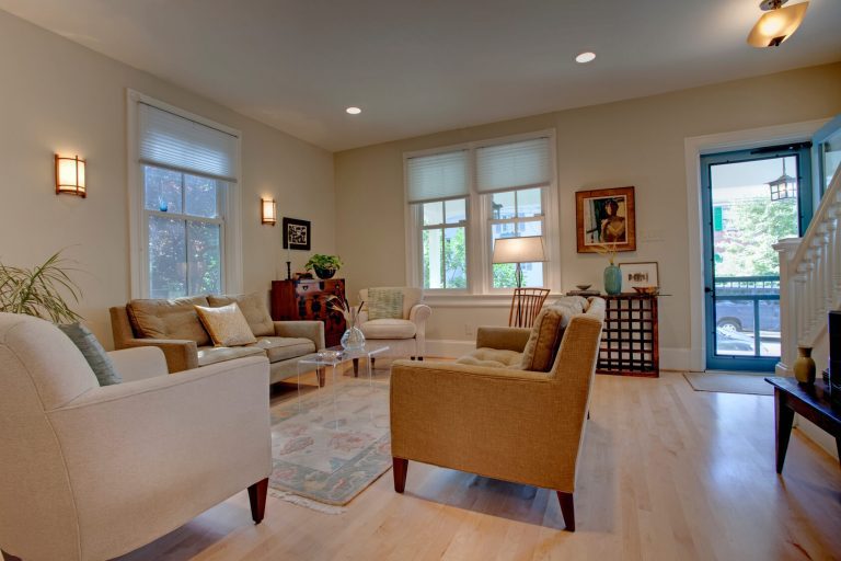 renovated living area in dc home light color palette exposed brick column