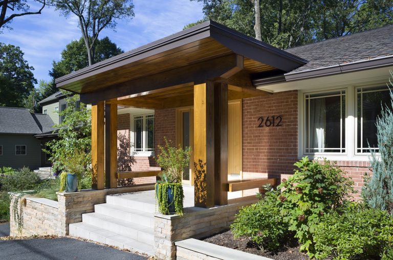 updated modern brick home front porch curb appeal wood columns stone foundation mixed materials