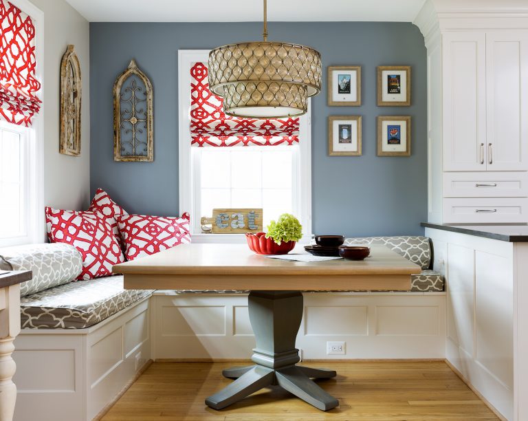 eat in area in kitchen light blue walls red accents banquette seating