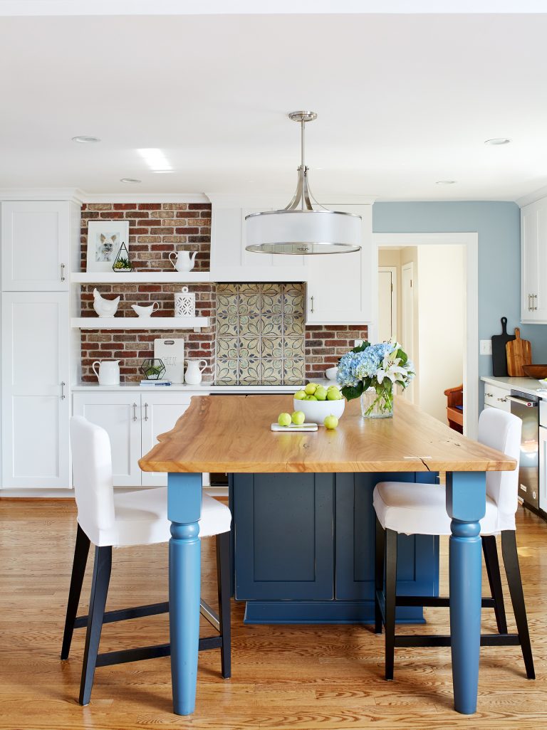 blue kitchen island with a butternut oak top