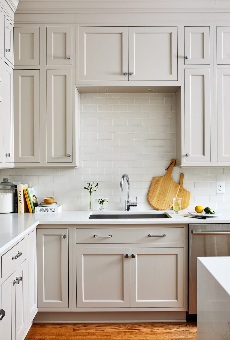 farm house sink with chrome faucet white marble counter top