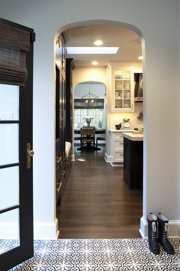 Living room with patio door and archway to kitchen