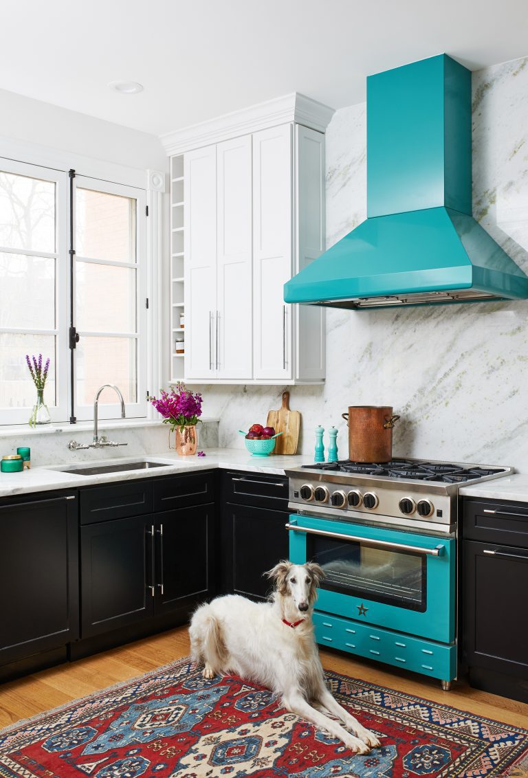 white wooden kitchen cabinet with granite white counter top and silver steel sink and glass door window