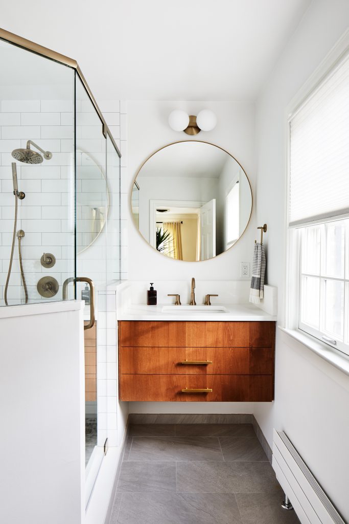 modern bathroom in white with small wooden vanity