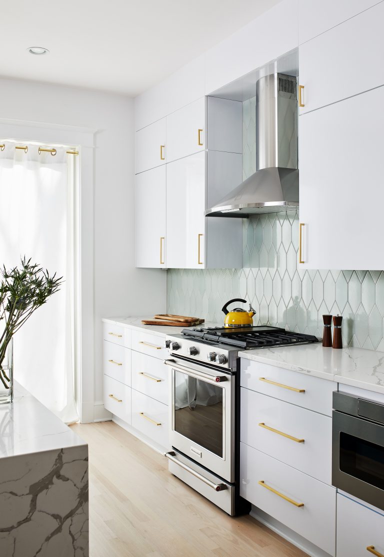 white cabinets with gold handlers