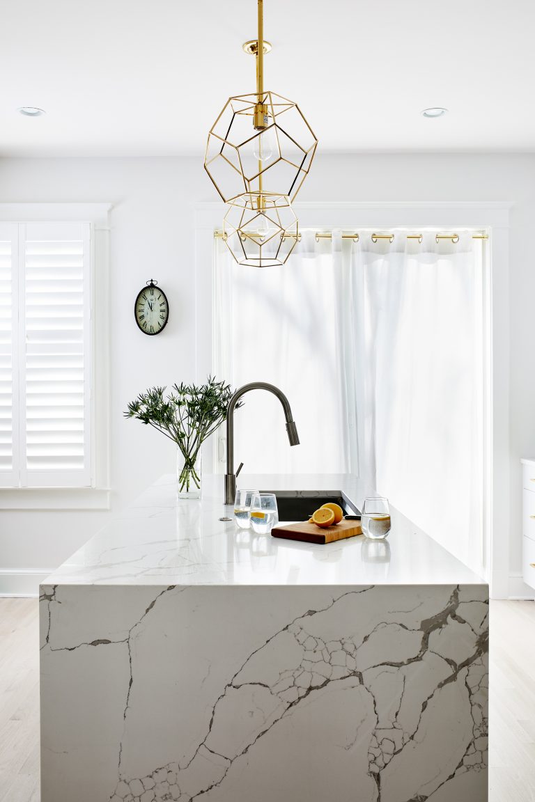 gold pendant lighting over a kitchen island