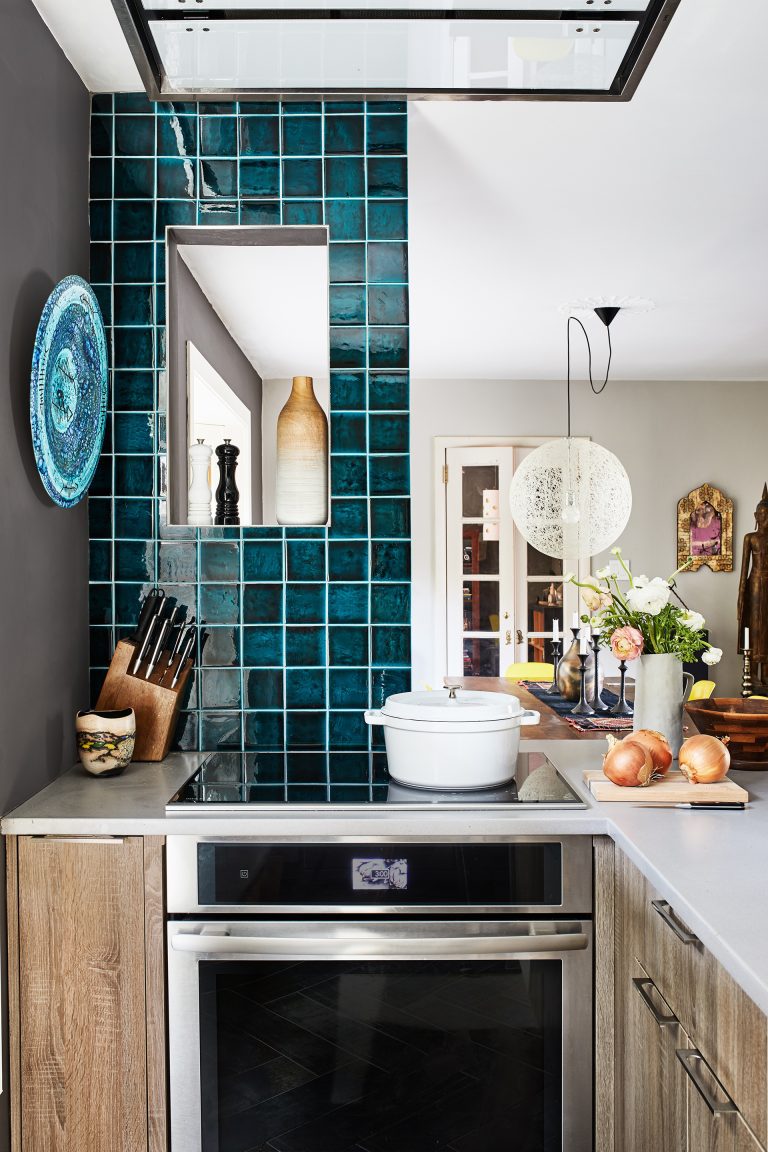 stainless steel electric range and sleek hood in ceiling