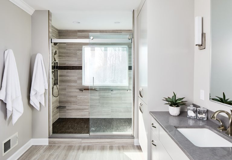 Bathroom remodeling Maryland with large walk-in shower with glass sliding shower door
